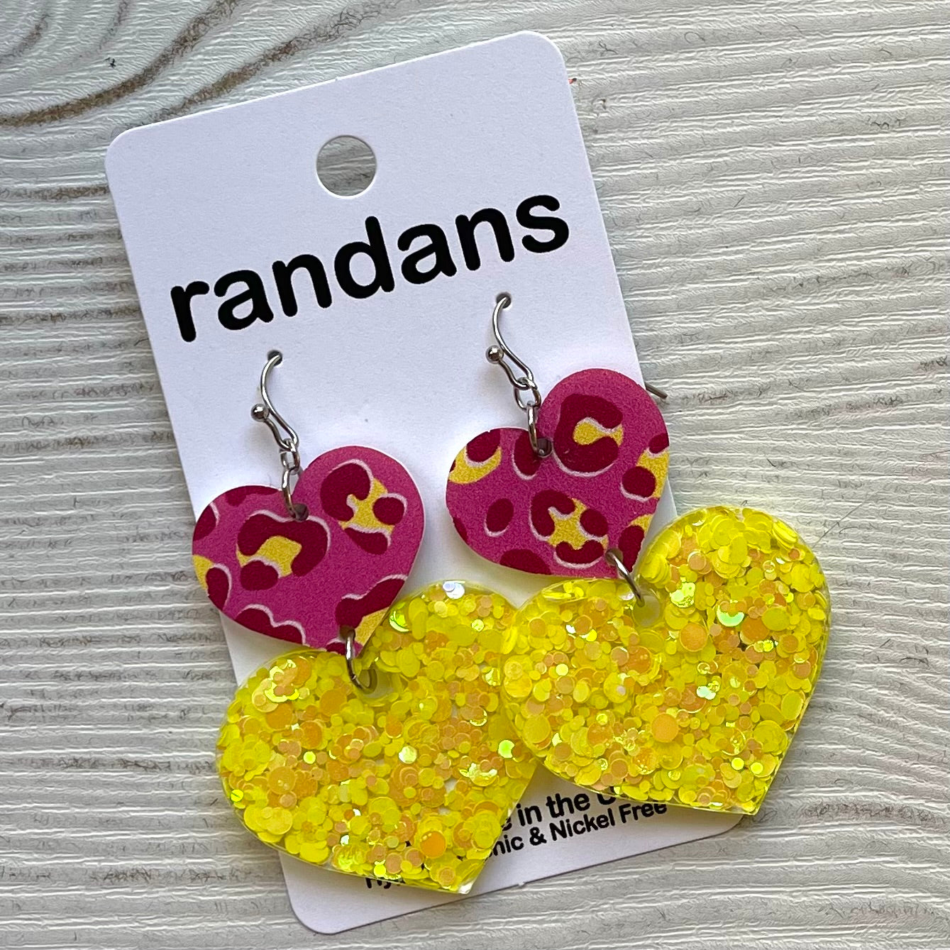 Two tier heart dangle earrings- pink and yellow leopard